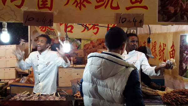 Black dudes BBQing in Tianhe Flower Market for Chinese New Year 2016