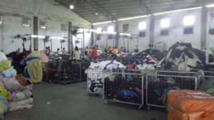 Africans sorting clothes in Baiyun sweatshop
